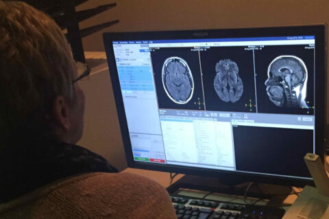 Technician views results of MRI